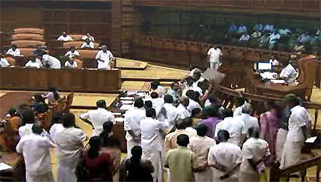 Chief Minister Oommen Chandy winding up debate on the Budget as Opposition protests on Feb. 18